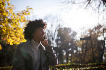 Afro woman having fun in the park