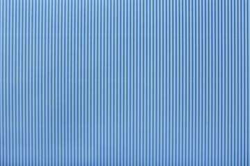 Texture of corrugated light blue paper, macro.