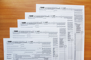 Fototapeta premium 1040 tax forms on a wooden table