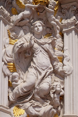 Fototapeta premium Virgin Mary, House of Falcon, the finest Rococo style building in the Wurzburg, Germany