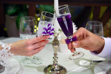 Rendezvous of lovers in a cafe. Hands with glasses in hand. 