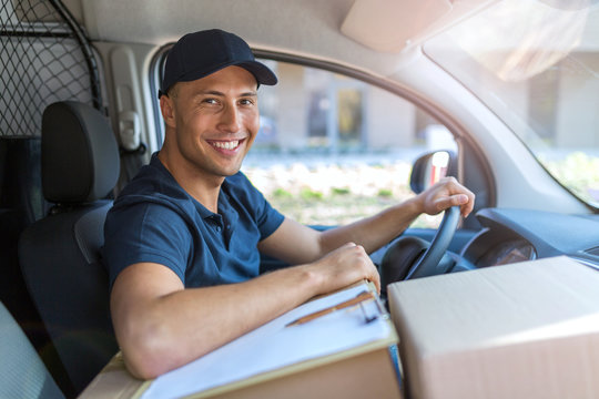 Delivery man sitting in a delivery van