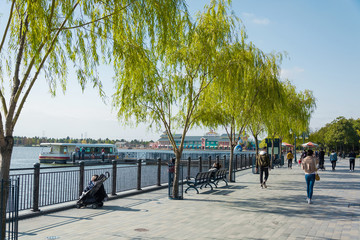 Street view of a street which is located beside to a lake in China