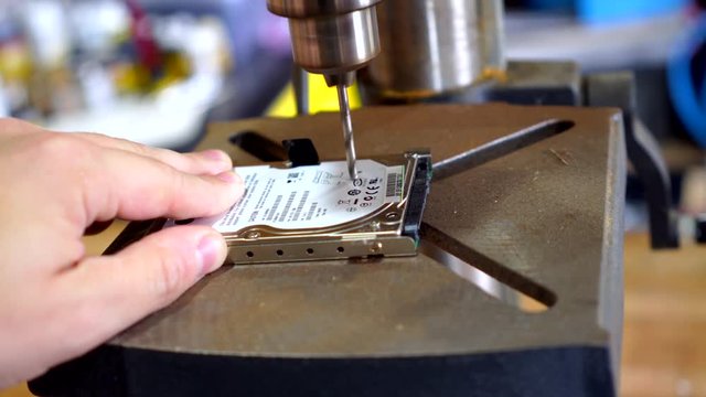 Destroying a hard drive with a drill press