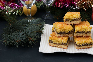 Banana cake with coconut flakes - festive dessert for Christmas, New Year, Close-up