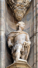 Statue of Saint on the facade of the Milan Cathedral, Duomo di Santa Maria Nascente, Milan, Lombardy, Italy