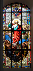 Fototapeta na wymiar Ascension of Christ, stained glass window in the Saint Nicholas Evangelical church, Aalen, Germany