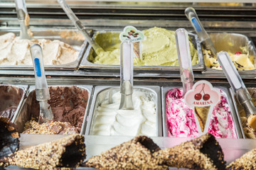 Fototapeta na wymiar Ice cream parlor. Ice cream tubs and chocolate cones