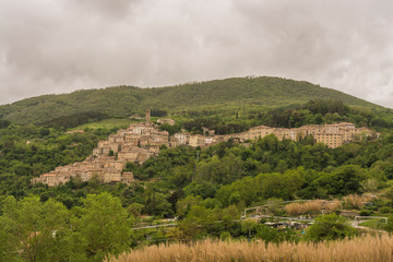 Tuscany, Italy - panorama of a village in the middle of the meadows