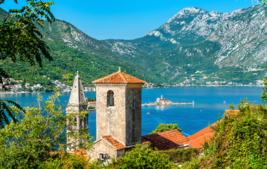 Fototapeta na wymiar View of the Bay of Kotor with two small islands and bell towers in Perast, Montenegro
