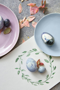 Easter composition of eggs on a plate and a painted circular frame