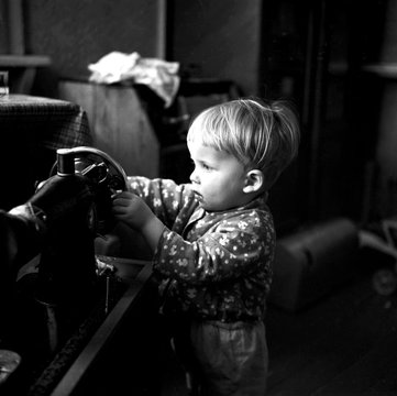 Boy with a sewing machine