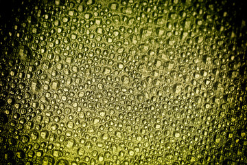 Drops of water on a color background. Orange. Shallow depth of field. Selective focus. Toned