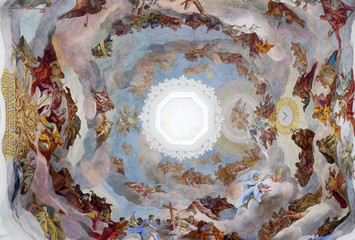Adoration of the Holy Trinity by saints and angels ceiling fresco in Neumunster Collegiate Church in Wurzburg, Germany