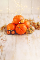 winter still life with tangerines on  light background. soft focus, blurred background