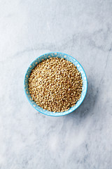 Organic Buckwheat in a Bowl on stone background. Healthy cooking with natural ingredients. Flatlay