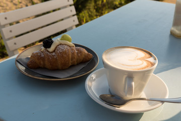 Breakfast at the beach with pasta and capuccino