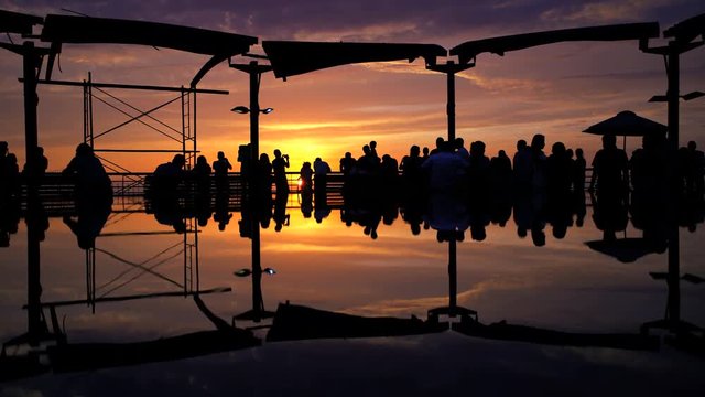 People viewing golden sunset Larcomar Shopping Mall Miraflores coastal district Pacific ocean Lima Peru South America 
