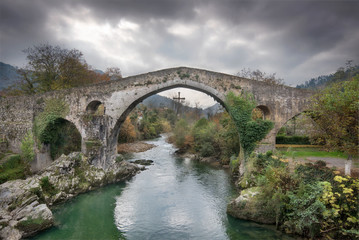 Fototapeta na wymiar Ancient Roman bridge in Cangas de Onis, Asturias, Spain.