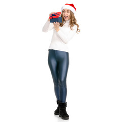 Woman with santa hat and gift box in hand smiling happy on white background isolation