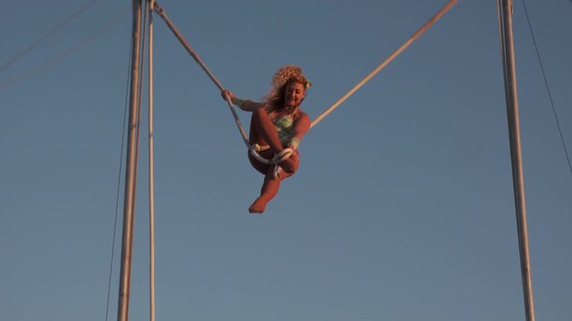 Women Acrobatic on high swing