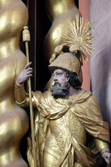 Obraz premium Saint Vitalis statue on the main altar in Cistercian Abbey of Bronbach in Reicholzheim near Wertheim, Germany