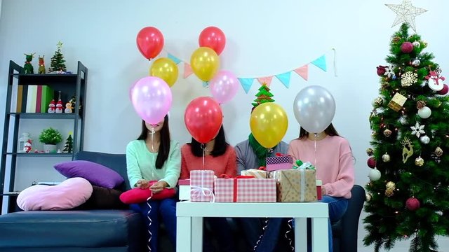 icture showing group of friends celebrating Christmas at home. surprised friend happy in office