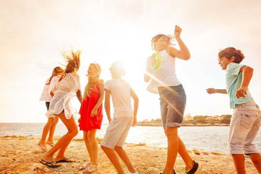 Happy teenagers having fun during beach party
