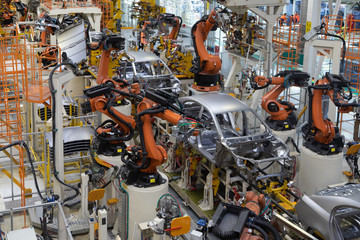 body of car on conveyor top view. Modern Assembly of cars at the plant. The automated build process...