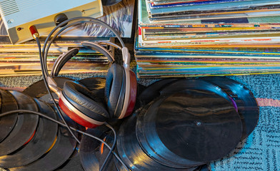 Headphones & vinyl 45 e 33 rpm records collection. Listen to analog disc with headphones. Hi fi...
