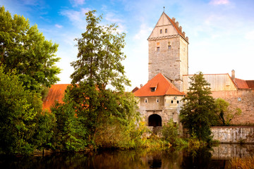 Obraz premium Historic old town of Dinkelsbuhl, reflecting in the river. landmark at the romantic road middle Franconia, Germany
