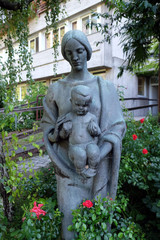 Virgin Mary with baby Jesus statue in the garden of the Blind Center Saint Raphael in Bolzano, Italy
