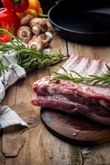 fresh meat on a wooden board. Steak, ribs polar bear, heel