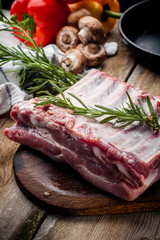 fresh meat on a wooden board. Steak, ribs polar bear, heel