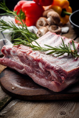 fresh meat on a wooden board. Steak, ribs polar bear, heel