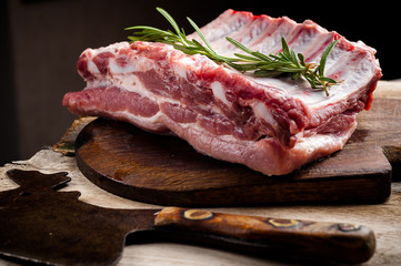 fresh meat on a wooden board. Steak, ribs polar bear, heel