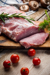 fresh meat on a wooden board. Steak, ribs polar bear, heel