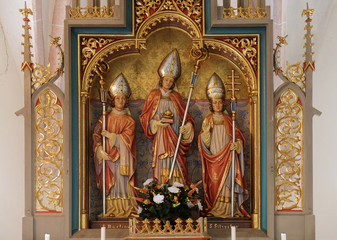 Saint Martin, Nicholas and Sylvester, statues on the main altar in the Saint Nicholas church in Petschied near Luson, Italy