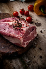 fresh meat on a wooden board. Steak, ribs polar bear, heel