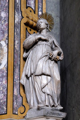 Obraz premium Saint Christina statue on the altar in the Cathedral of Santa Maria Assunta i San Cassiano in Bressanone, Italy