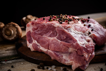 fresh meat on a wooden board. Steak, ribs polar bear, heel