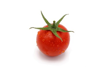 fresh red tomato with drops of water isolated on white