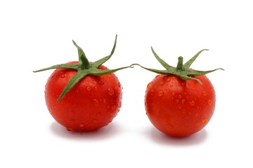 fresh red cocktail tomatos with drops of water isolated on white