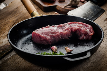 fresh meat on a wooden board. Steak, ribs polar bear, heel