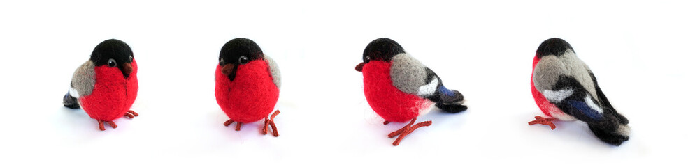Felted toy bullfinch on a white background