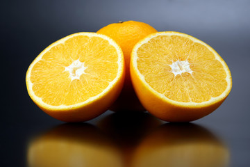 Citrus fruit sliced orange fruit on a dark background