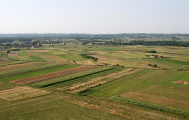 Fototapeta na wymiar Aerial view of meadows and fields in Nothern Croatia in summertime, Zdencina, Croatia