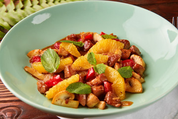 Veal stew with vegetables and oranges