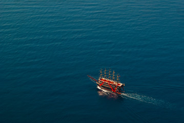 red boat in blue sea 