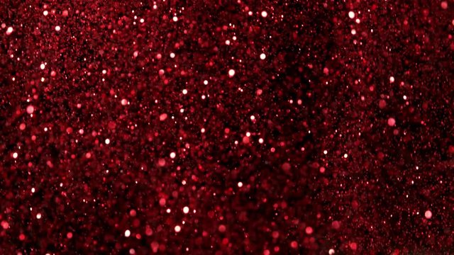 Red glitter explosion in super slow motion shooted with high speed cinema camera at 1000fps 4K.